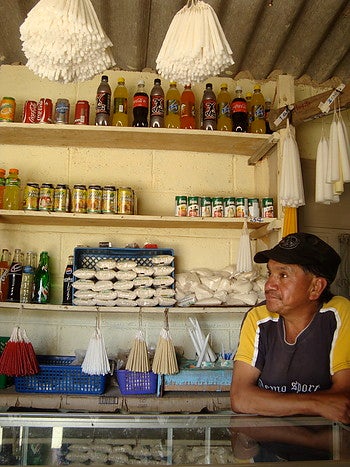 Don Celso sells candles, incense, and other items used during Mayan ceremonies