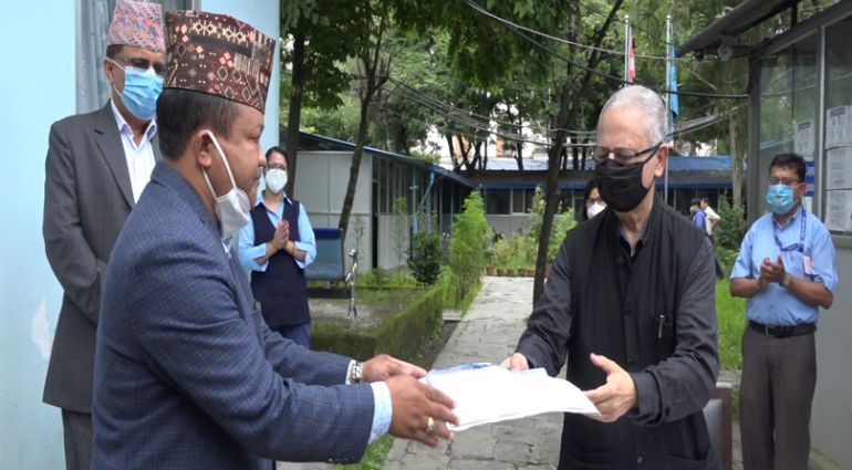 Chairperson of Nepal Federation of Nepalese Indigenous Nationalities (NEFIN) handing over Memorandum to National Human Rights commission Chair Anup Raj Sharma. 