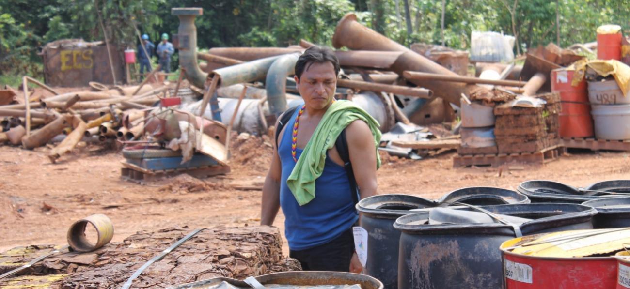 Apu David Chino observes industrial waste left behind by oil companies, November 2013