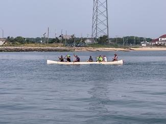 Photo of Crew paddling in the Shinnecock Bay past the US Coast Guard Photo taken by local boater
